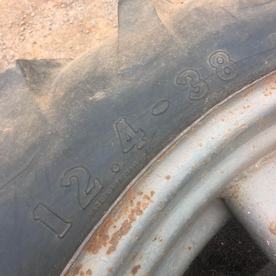 Pair of tractor tyres and rims with Massey Ferguson 65 stud pattern